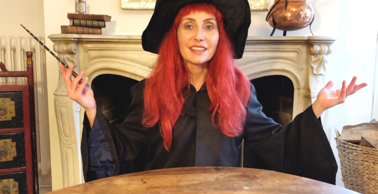 Anna Yaga, red hair witch, waving a magic wand presenting best activities for harry potter party