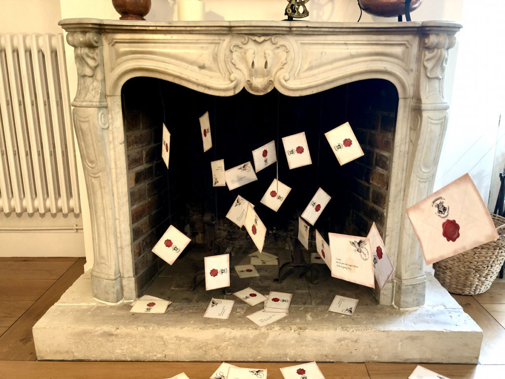 the letters from Hogwarts flying out of the fireplace